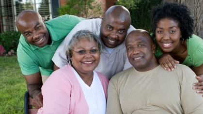 Family poising outdoors