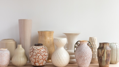 Collection of different sized beige vases
