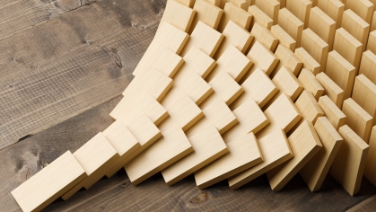 Wooden dominos shaped in a pyramid form