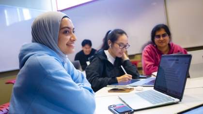 Zehra Jaffri (SAS '24), Ruofan Chen (SOE '25), and Sahana Ranganathan (SOE '25) use their laptops to study in the Busch Learning Center