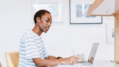 woman working on laptop in home office