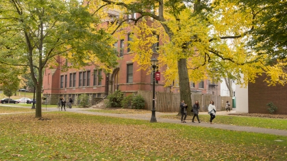 People walk along Voorhees Mall at Rutgers in the fall