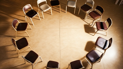 Circle of empty chairs facing each other