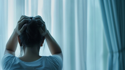 Person holding their head