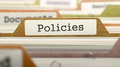 files labled policies in filing cabinet
