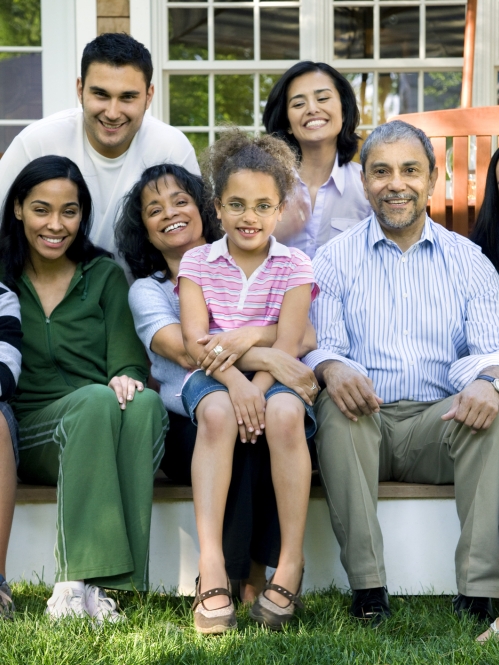 multigenerational family members sitting outside
