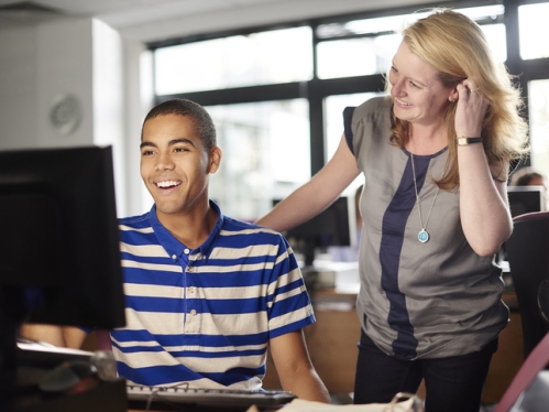 Student and professor viewing PC