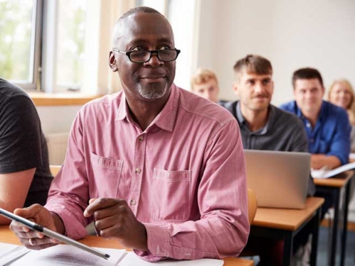 Male student in pink shirt