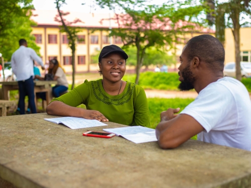 Two students studying outdoors