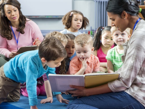 teachers and young children in early childhood classroom