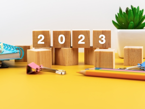 wooden blocks spelling 2023 on desk