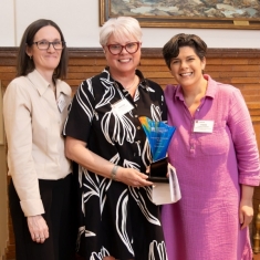 Merced receiving award